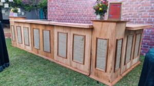 Solid mahogany panel bar with jute accents - front view at event setup