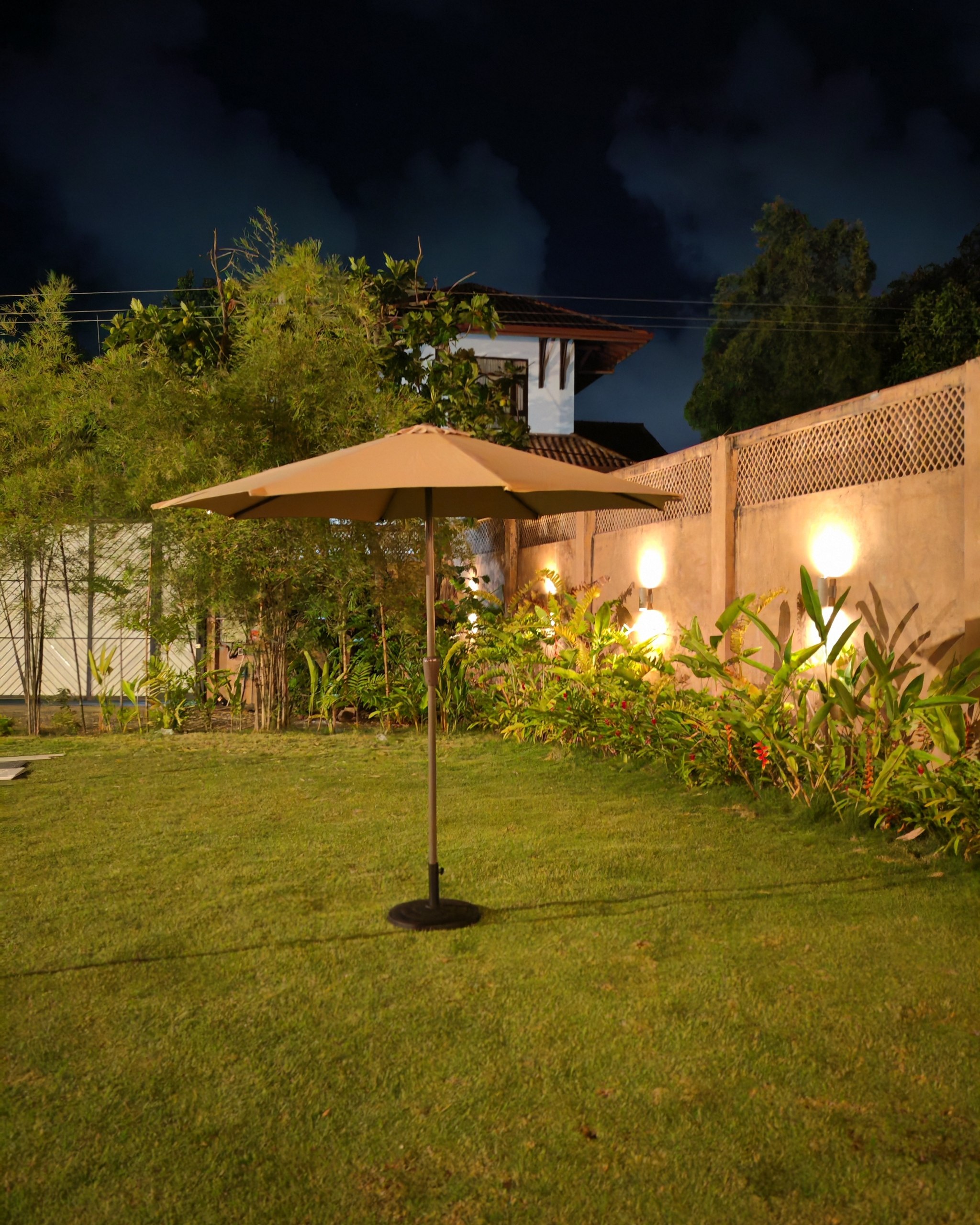 Rent or similar products at EventRentals.lk Garden Umbrella on lawn